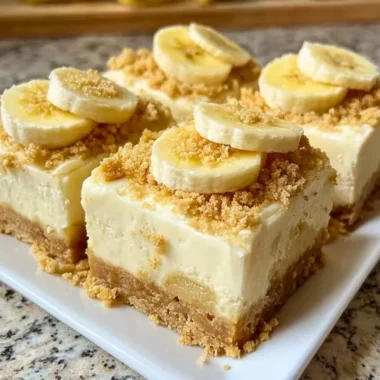 Banana pudding cheesecake squares dessert slice on a plate