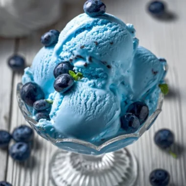 A bowl of homemade Blue Moon Ice Cream with vibrant blue color and creamy texture.