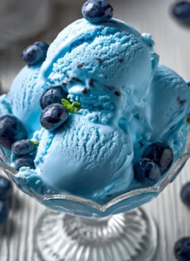 A bowl of homemade Blue Moon Ice Cream with vibrant blue color and creamy texture.