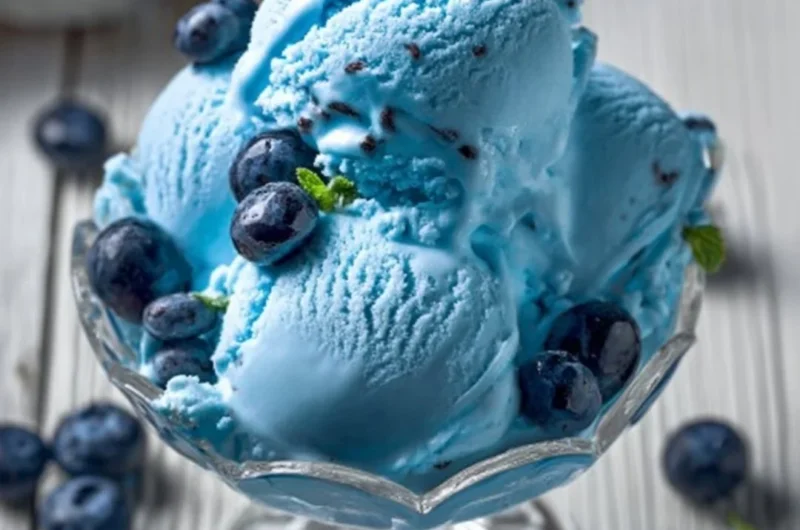 A bowl of homemade Blue Moon Ice Cream with vibrant blue color and creamy texture.