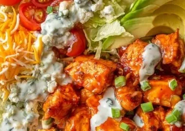Delicious Buffalo Chicken Bowls served with fresh ingredients and spicy sauce
