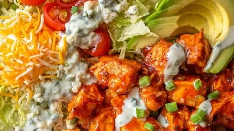 Delicious Buffalo Chicken Bowls served with fresh ingredients and spicy sauce