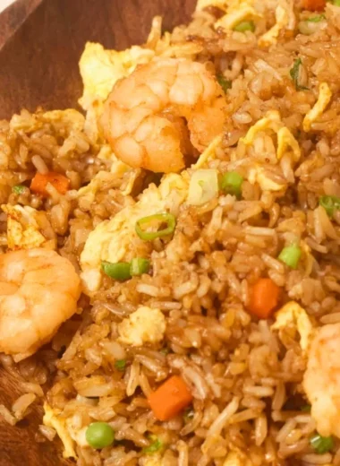 Plate of homemade Chinese shrimp fried rice with vegetables