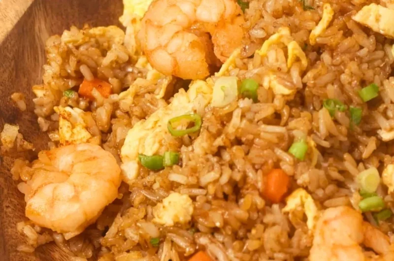Plate of homemade Chinese shrimp fried rice with vegetables