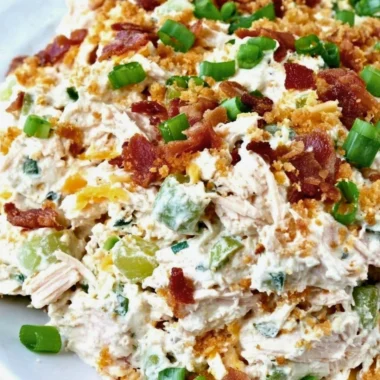 Keto Jalapeño Popper Chicken Salad served in a bowl with jalapeños and herbs