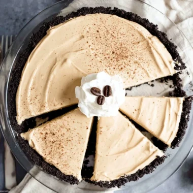 A delicious no-bake coffee pie topped with whipped cream and chocolate shavings