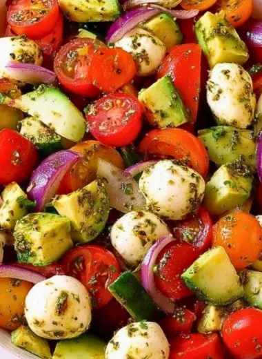 Healthy Tomato Cucumber Salad with Avocado, Mozzarella, and Basil Pesto