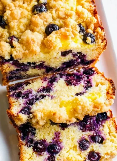 Freshly baked blueberry lemon loaf with a golden crust and vibrant blueberries