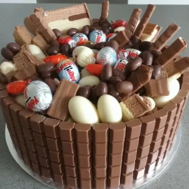 Delicious Chocolate Kinder Surprise Cake with Kinder chocolate and colorful eggs
