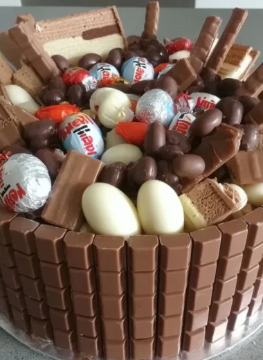 Delicious Chocolate Kinder Surprise Cake with Kinder chocolate and colorful eggs