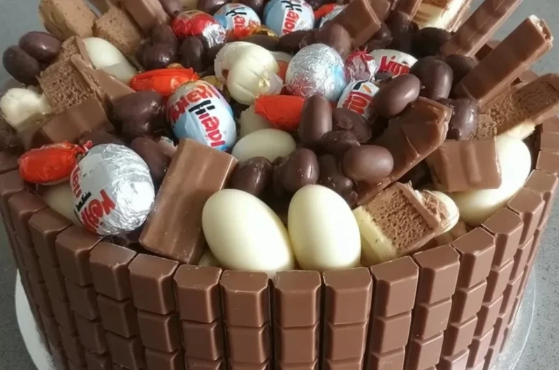 Delicious Chocolate Kinder Surprise Cake with Kinder chocolate and colorful eggs