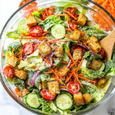 A fresh and colorful classic house salad with greens and vegetables.