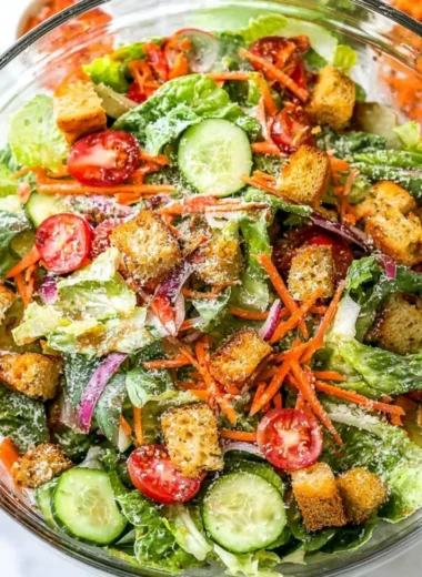 A fresh and colorful classic house salad with greens and vegetables.