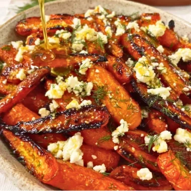 Honey garlic roasted carrots with feta cheese on a serving platter