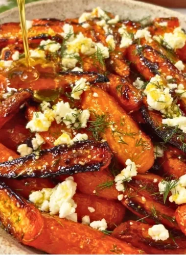Honey garlic roasted carrots with feta cheese on a serving platter