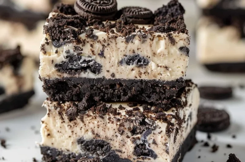 Oreo Cheesecake Bars with a crust made of crushed Oreos and creamy cheesecake filling