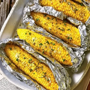 Oven-roasted corn on the cob served with seasoning