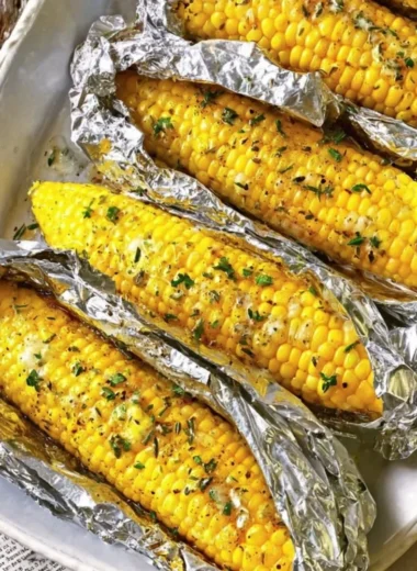 Oven-roasted corn on the cob served with seasoning