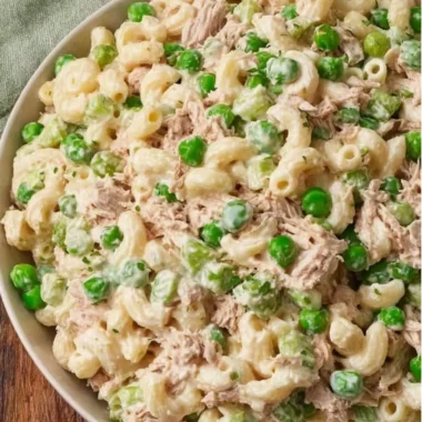 Bowl of refreshing Tuna Pasta Salad with vegetables and dressing