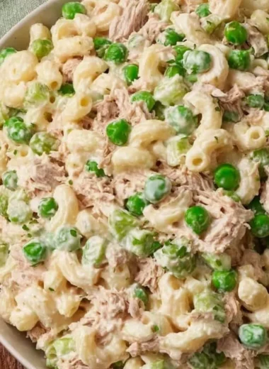 Bowl of refreshing Tuna Pasta Salad with vegetables and dressing