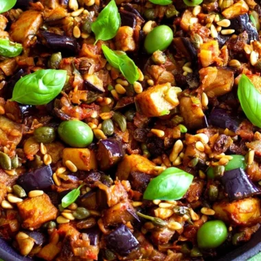 Delicious Caponata served in a bowl with fresh ingredients.