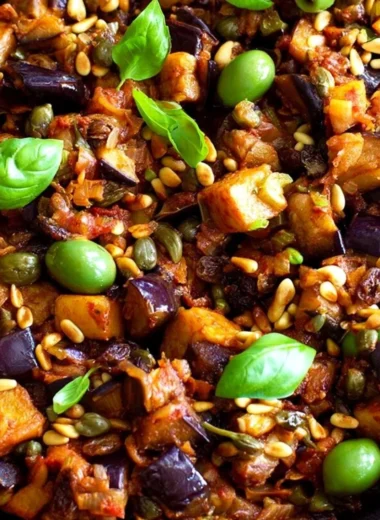 Delicious Caponata served in a bowl with fresh ingredients.