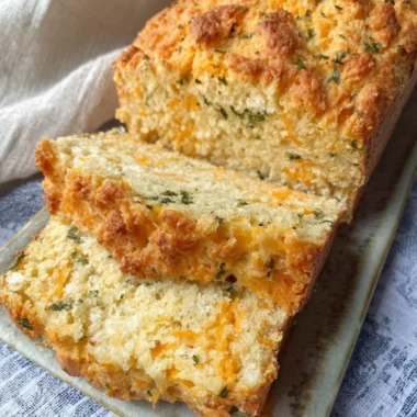Freshly baked Cheddar Bay Biscuit Bread served on a wooden board