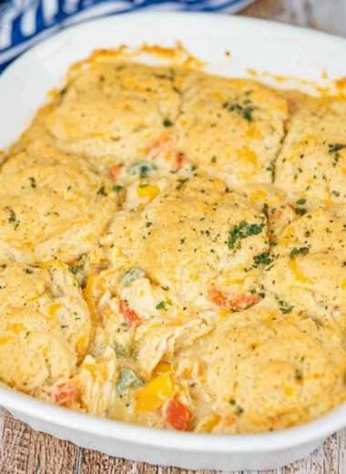 Cheddar Bay Chicken Pot Pie Casserole garnished with herbs in a rustic dish