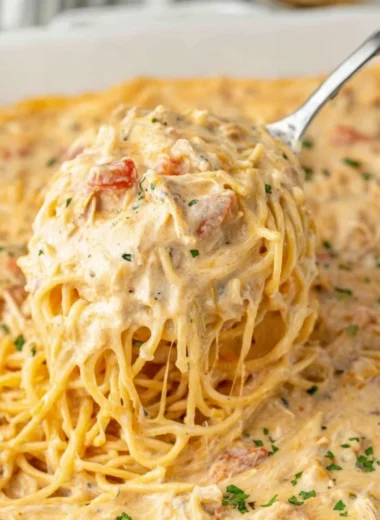 Delicious cheesy casserole bubbling in a baking dish, ready to serve.