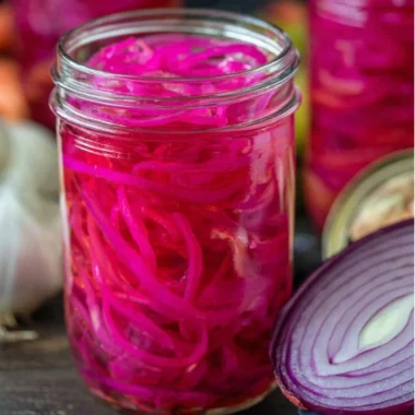 Jar of easy quick pickled red onions ready for serving.