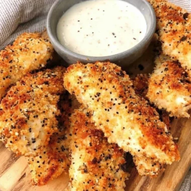 Crispy Everything Bagel Chicken Tenders with seasoning and dipping sauce