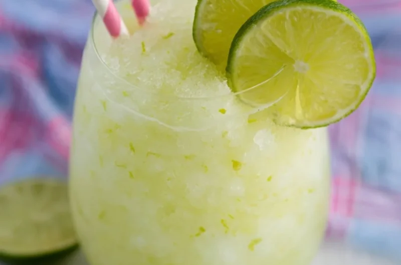 Refreshing Key Lime Cocktail with lime garnish in a glass