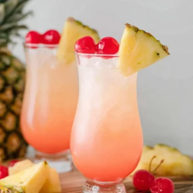 Malibu Bay Breeze cocktail with coconut rum and fruit garnishes in a glass