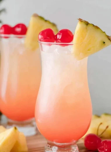 Malibu Bay Breeze cocktail with coconut rum and fruit garnishes in a glass
