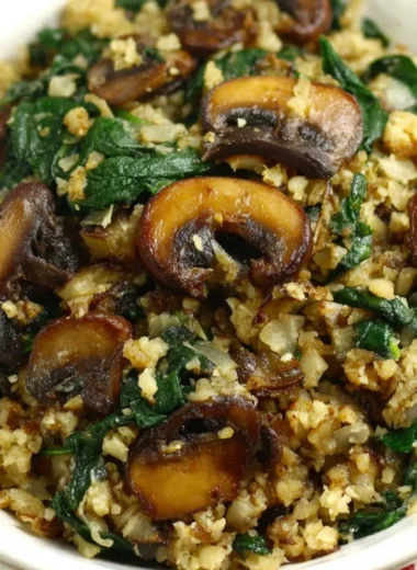 Mushroom Spinach Cauliflower Rice served in a bowl with fresh ingredients