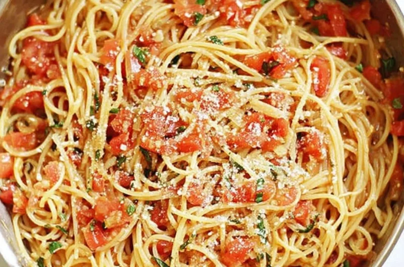 Delicious one-pot pasta dish served with fresh herbs and cheese.