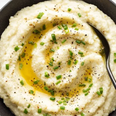Creamy mashed cauliflower served in a bowl, a healthy alternative to mashed potatoes.