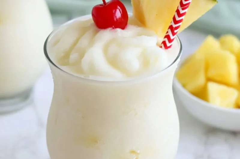 Refreshing virgin pina colada mocktail served in a tropical setting