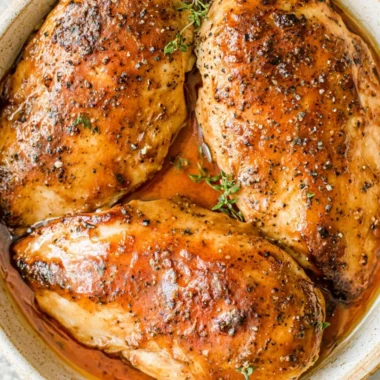 Juicy brown sugar garlic chicken breasts garnished with herbs