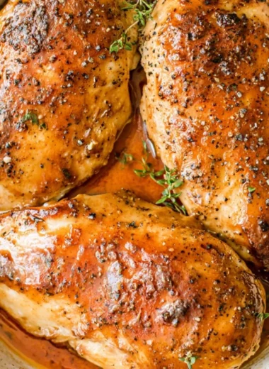 Juicy brown sugar garlic chicken breasts garnished with herbs