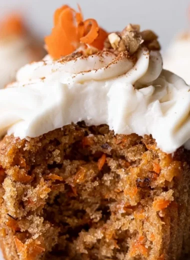 Cozy carrot cake cupcakes topped with cream cheese frosting
