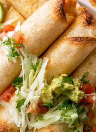 Crispy chicken flautas served with fresh toppings and dips.