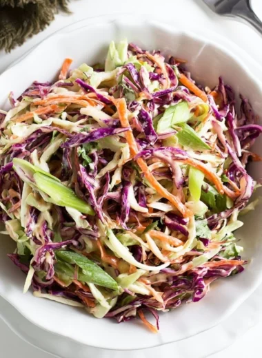Cozy coleslaw served alongside pulled pork sandwiches