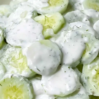 Creamy cucumber salad with fresh ingredients in a bowl ready to serve.