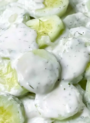 Creamy cucumber salad with fresh ingredients in a bowl ready to serve.