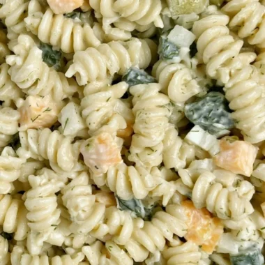 Delicious Dill Pickle Pasta Salad served in a bowl with fresh ingredients