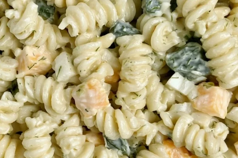 Delicious Dill Pickle Pasta Salad served in a bowl with fresh ingredients