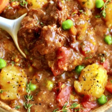 Bowl of hearty vegan gnocchi stew with colorful vegetables