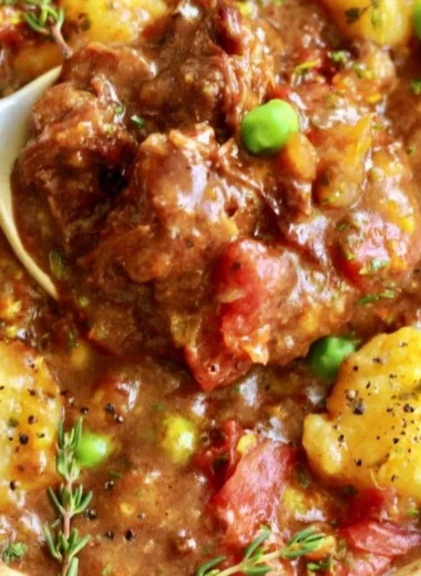 Bowl of hearty vegan gnocchi stew with colorful vegetables