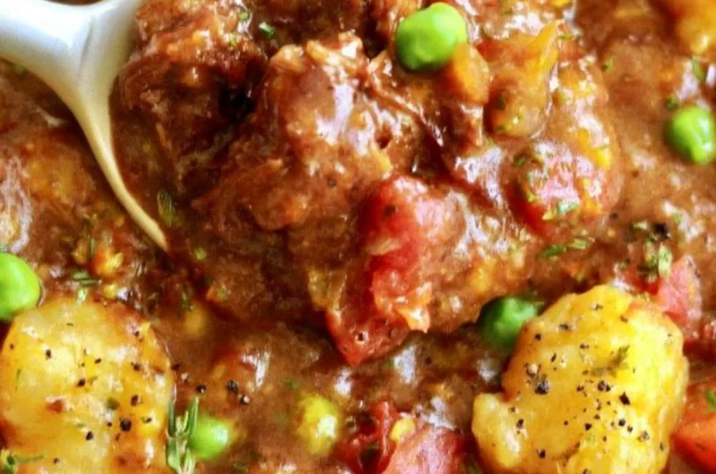 Bowl of hearty vegan gnocchi stew with colorful vegetables